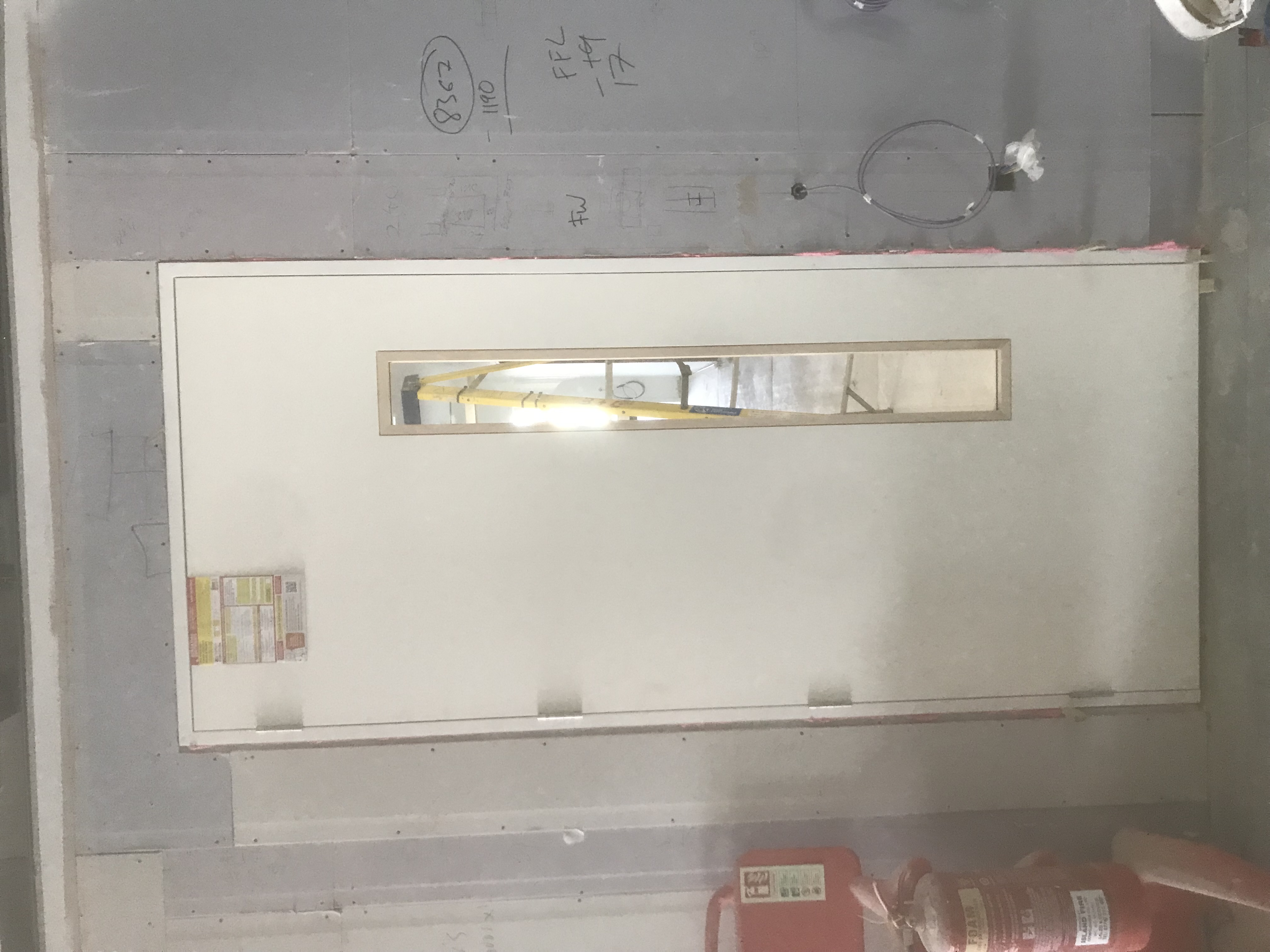 White fire door with vision panel installed
